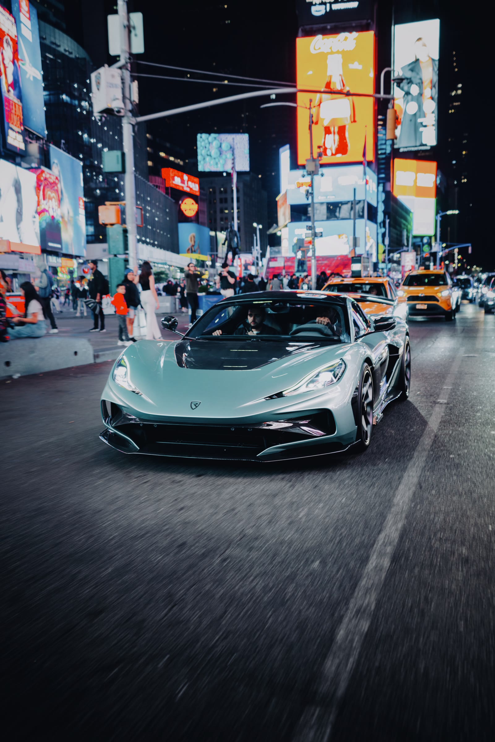 Rimac Nevera R driving through Times Square at night